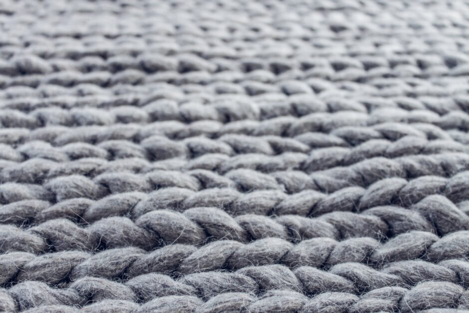 close up of gray cable knit cloth