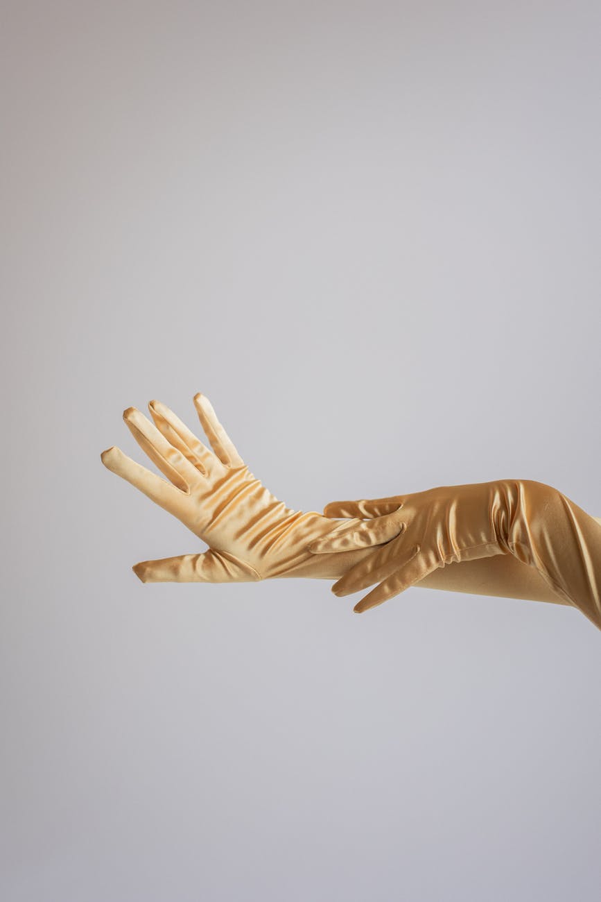 woman in satin evening gloves in studio