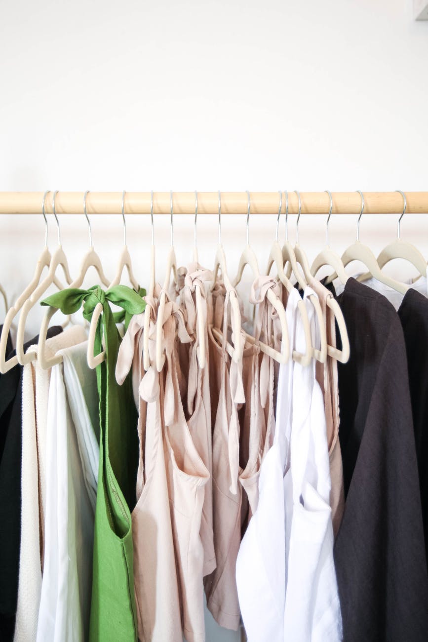 clothes hanging from a wooden hanger