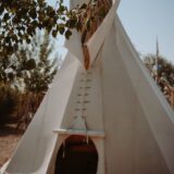 white teepee located in nature
