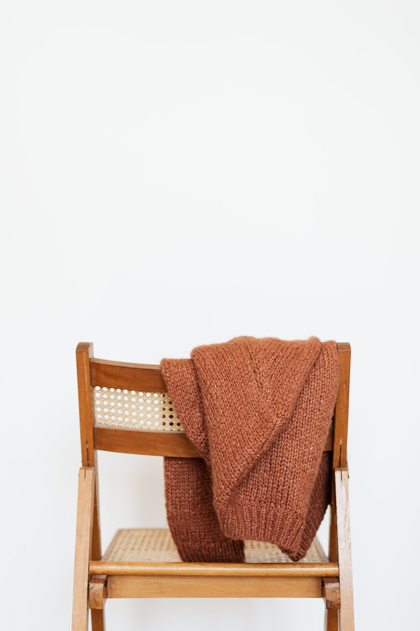 woolen sweater put on back of chair