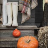 white boots and orange pumpkin on the stair