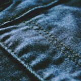 blue denim textile with brown button