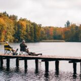 two men fishing on lake