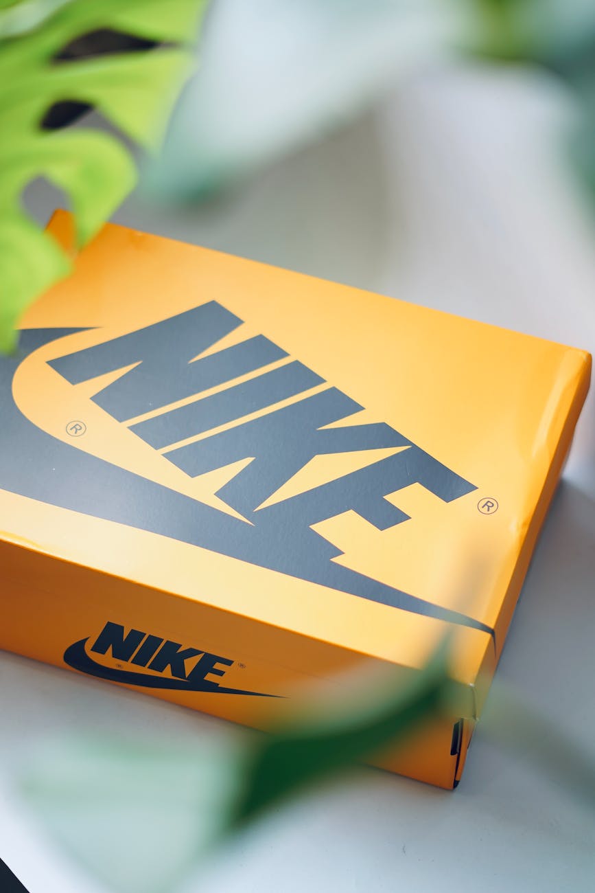 close up photo of a yellow nike shoebox