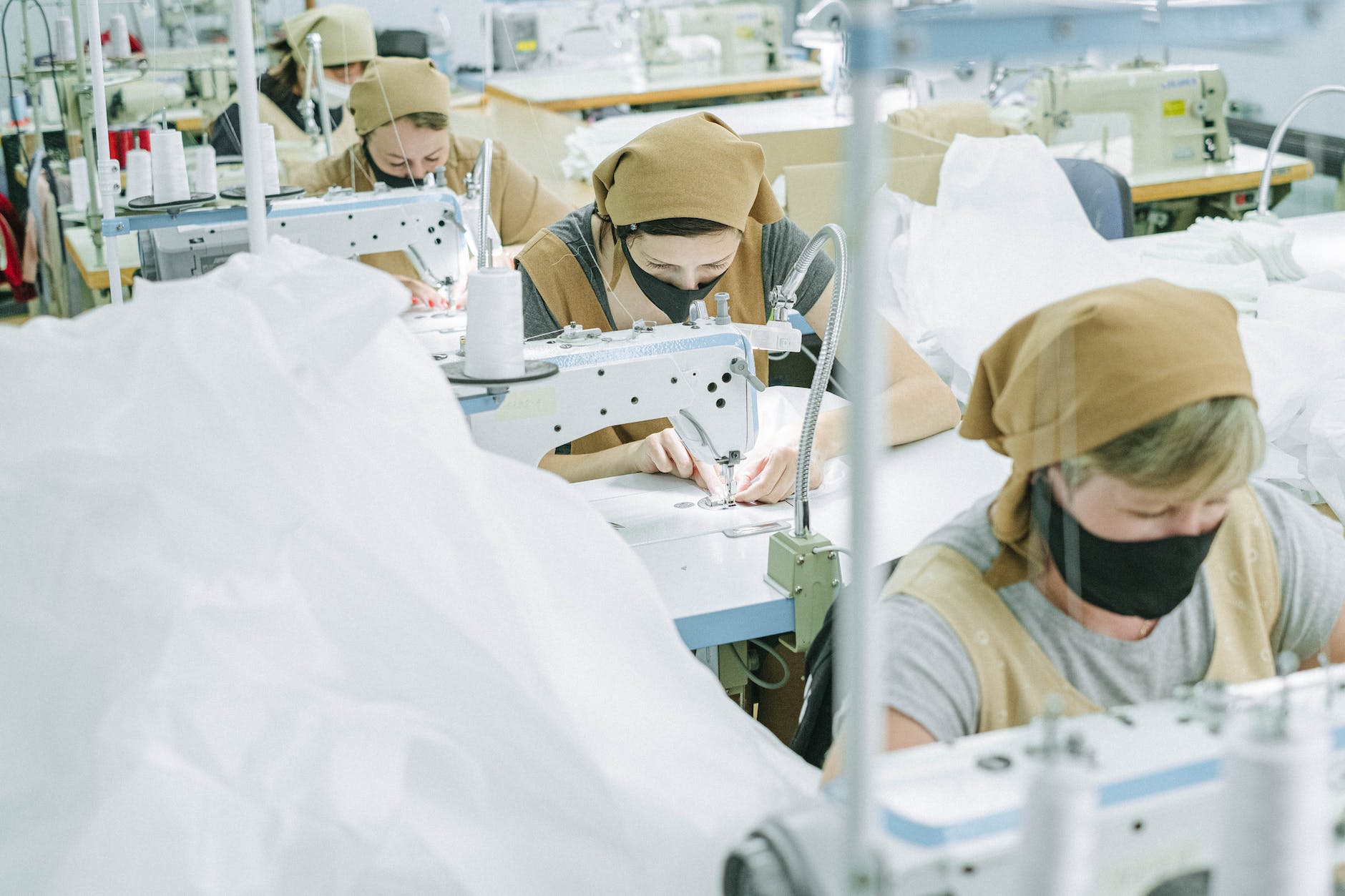 women sewing fabrics in a factory
