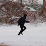woman running on snow in sweden