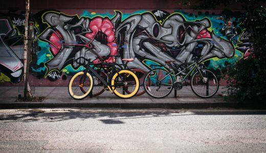 black and yellow fatbike beside mountain bikes
