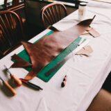brown leather textile on top of drafting board