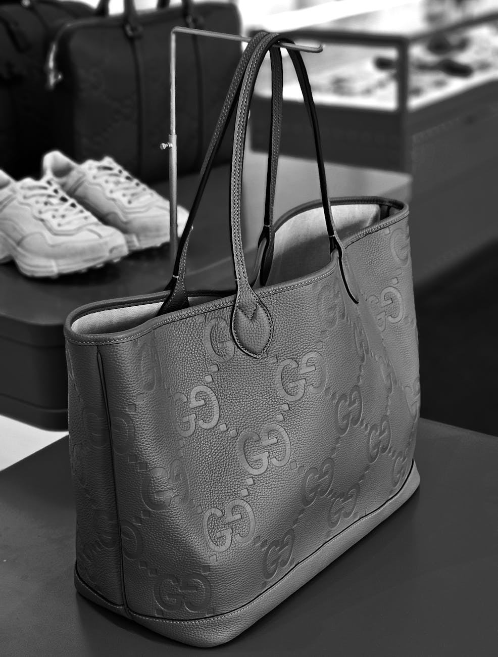 black and white shot of a handbag in a store