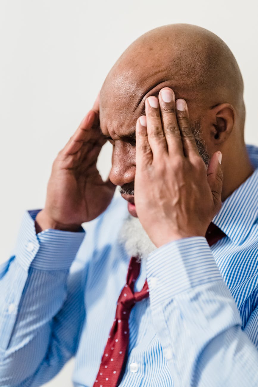 upset man touching his hand