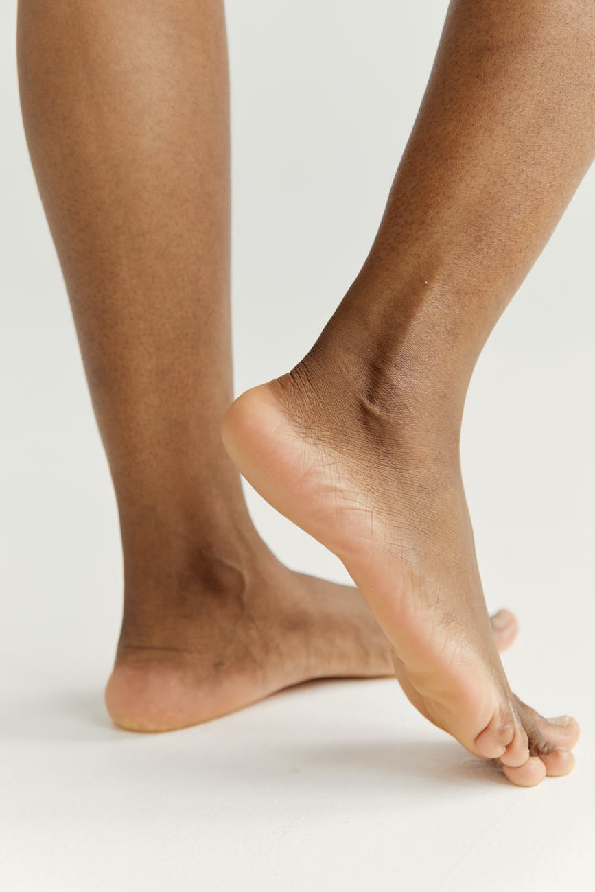 close up of feet against a white background