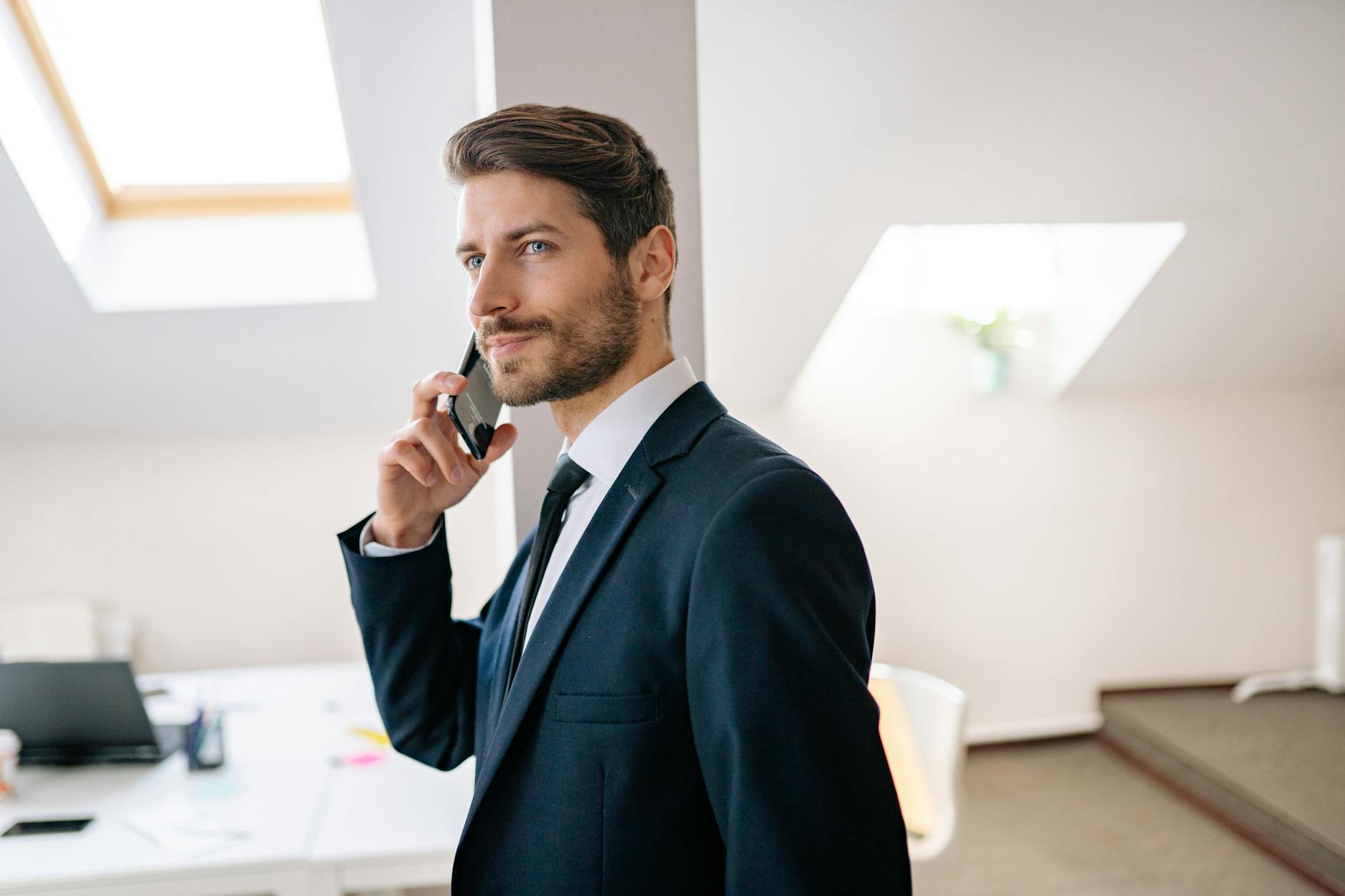 man in a suit on the phone