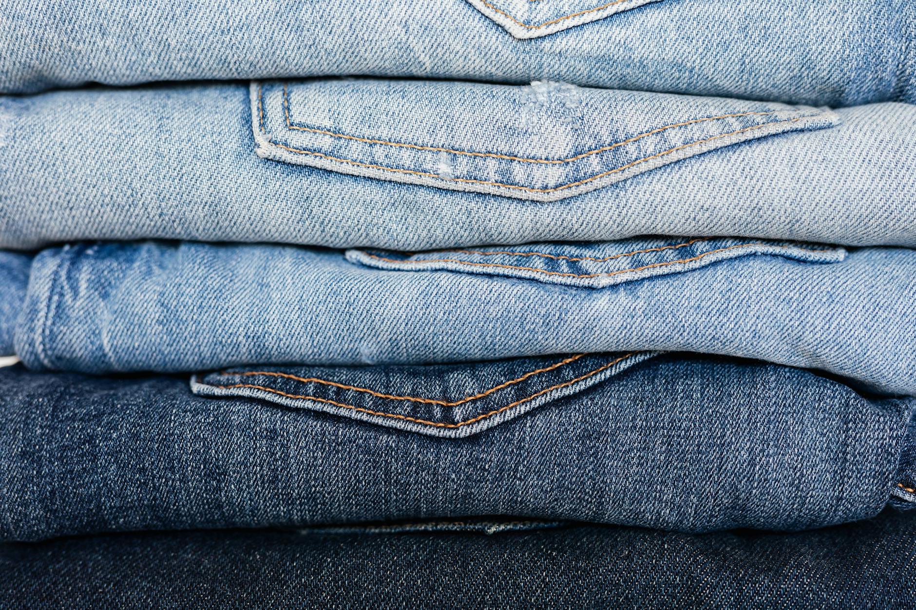 stack of neatly arranged blue jeans