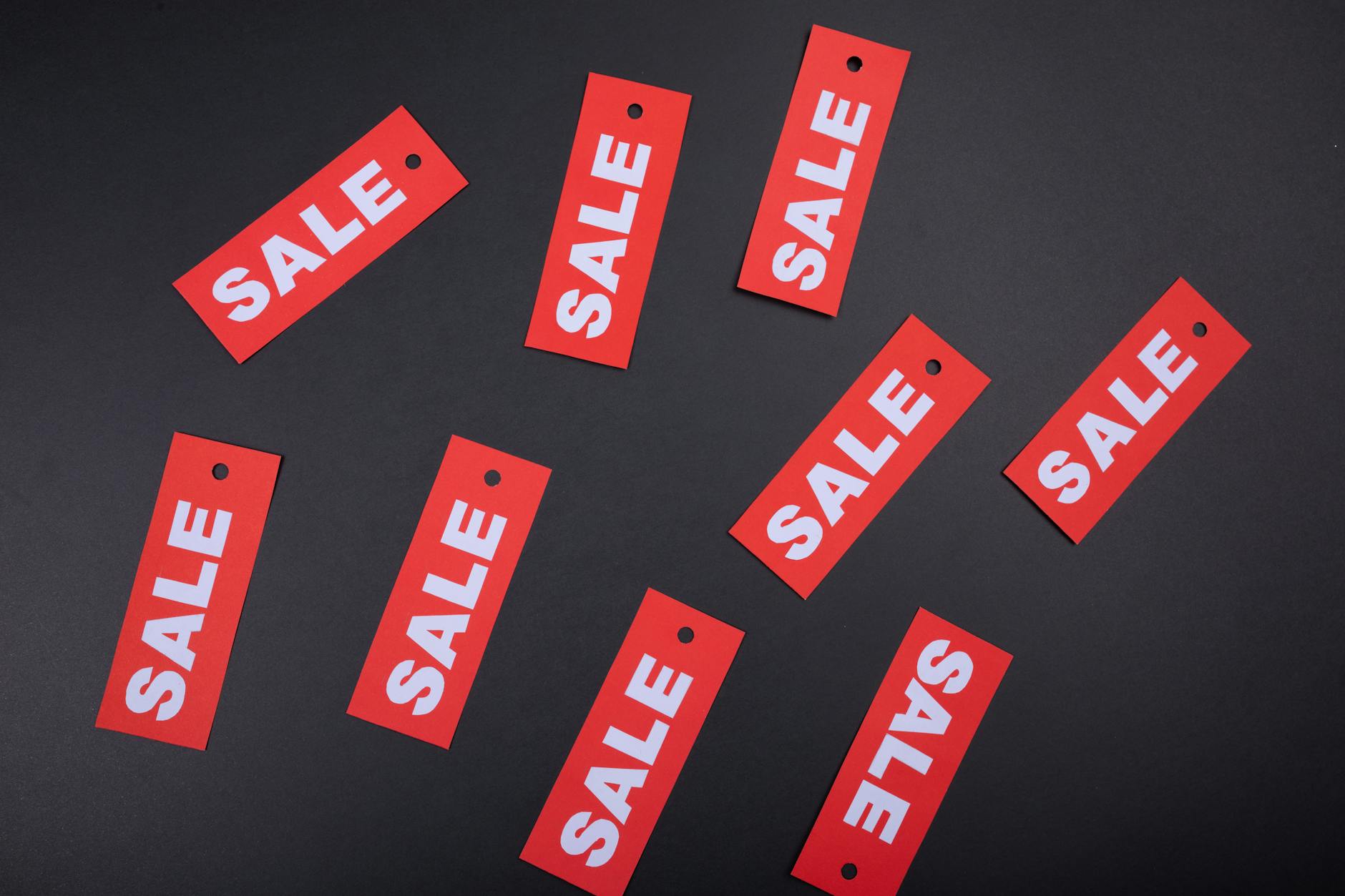 a red tag sale with black background